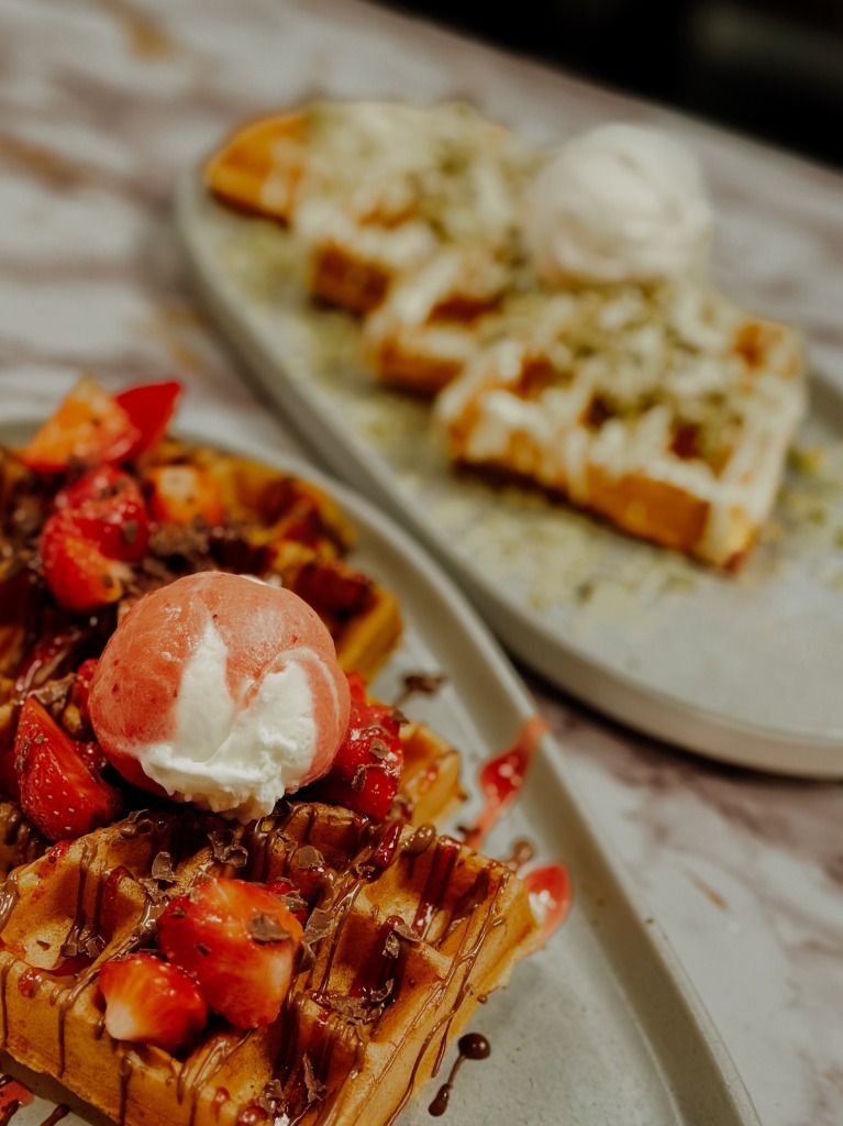 Berry Me in Chocolate Belgian Waffle topped with strawberries and gelato